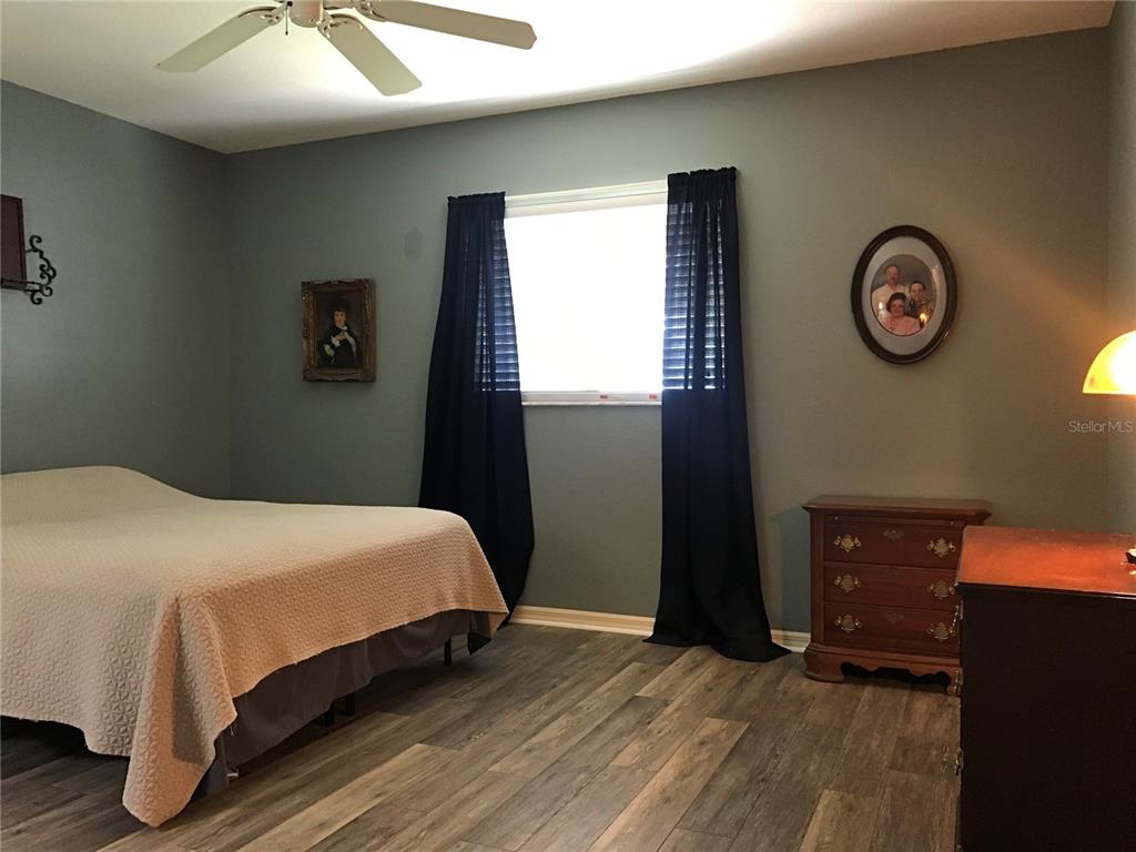 11879 Southwest 137th Loop Dunnellon, FL 34432 - Photo 14 of 37 a bedroom with a bed and a closet