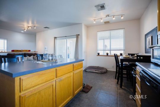 812 South Nevada Street Ridgecrest, CA 93555 - Photo 11 of 34 a view of a dining room with furniture and chandelier