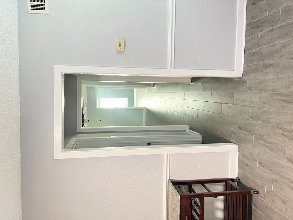 1114 Tillery Street, Unit A Austin, TX 78702 - Photo 6 of 8 a view of a hallway with wooden floor and closet