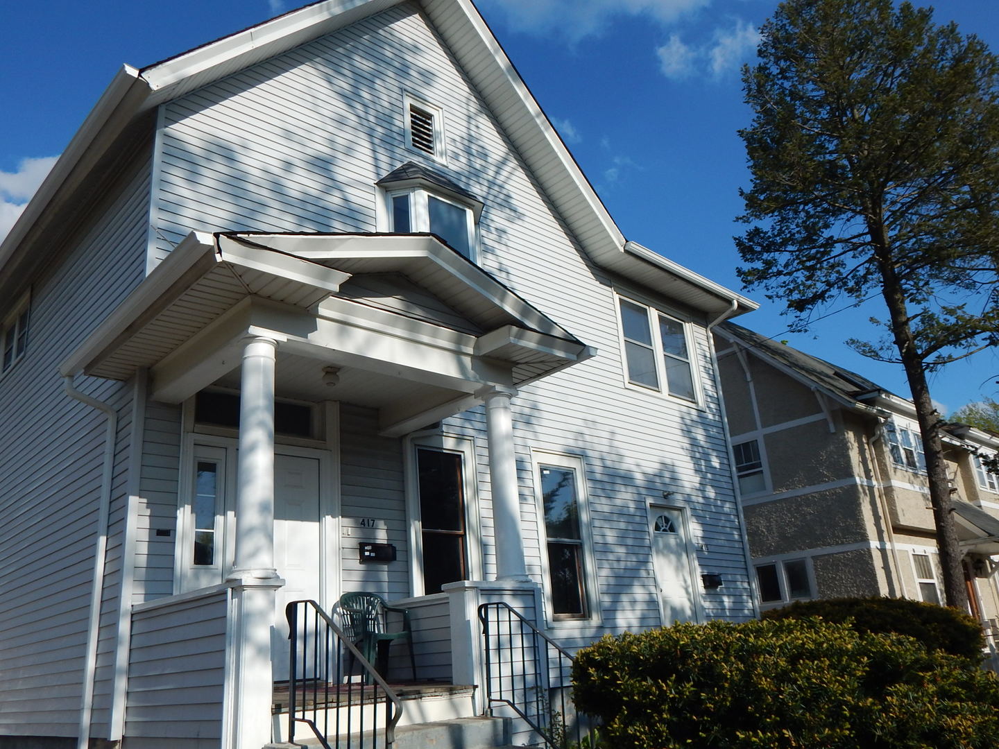 415 North Spring Street Elgin, IL 60120 - Photo 1 of 22 a view of a building with a tree