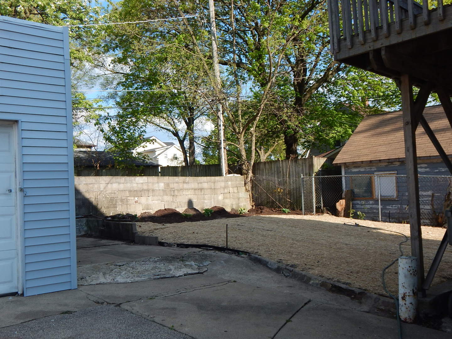 415 North Spring Street Elgin, IL 60120 - Photo 22 of 22 a backyard of a house with table and chairs