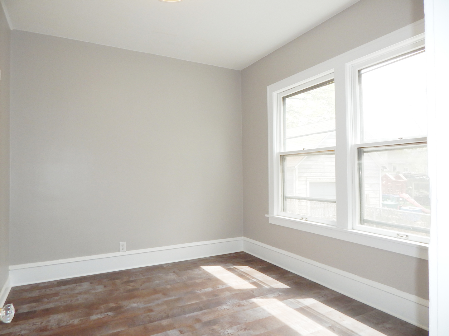 415 North Spring Street Elgin, IL 60120 - Photo 7 of 22 an empty room with a window