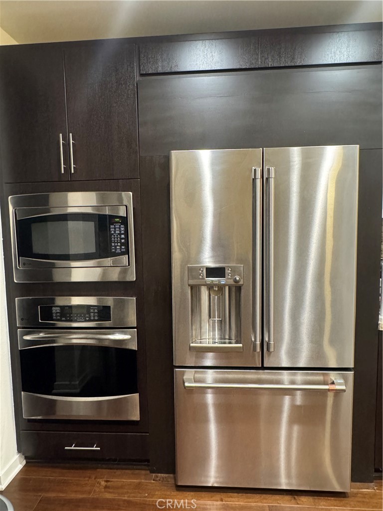 21 Gramercy, Unit 218 Irvine, CA 92612 - Photo 16 of 40 a metallic refrigerator freezer sitting in a kitchen