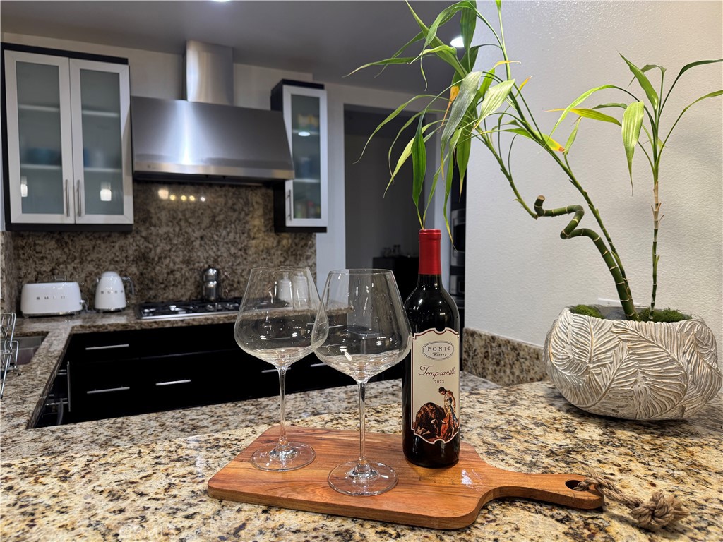 21 Gramercy, Unit 218 Irvine, CA 92612 - Photo 19 of 40 a living room with furniture and a lamp