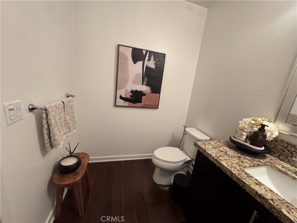 21 Gramercy, Unit 218 Irvine, CA 92612 - Photo 24 of 40 a bathroom with a granite countertop sink and a mirror