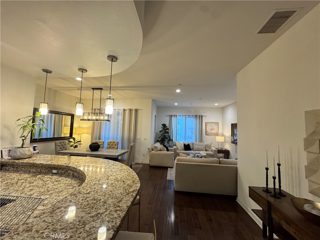 21 Gramercy, Unit 218 Irvine, CA 92612 - Photo 28 of 40 a large white kitchen with a large window and stainless steel appliances
