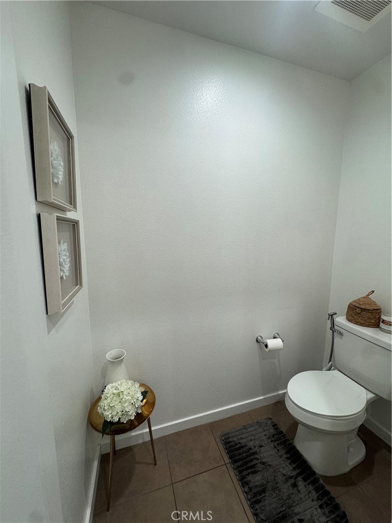 21 Gramercy, Unit 218 Irvine, CA 92612 - Photo 29 of 40 a bathroom with a toilet a sink and view