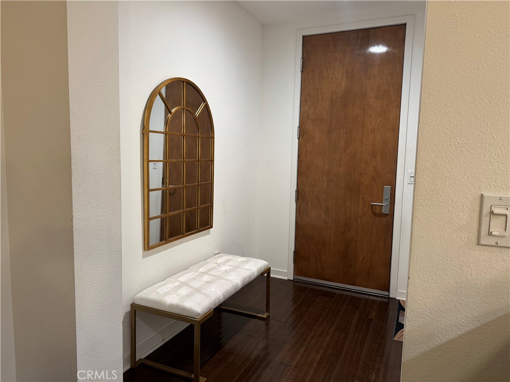 21 Gramercy, Unit 218 Irvine, CA 92612 - Photo 40 of 40 a view of a room that has a door and wooden floor