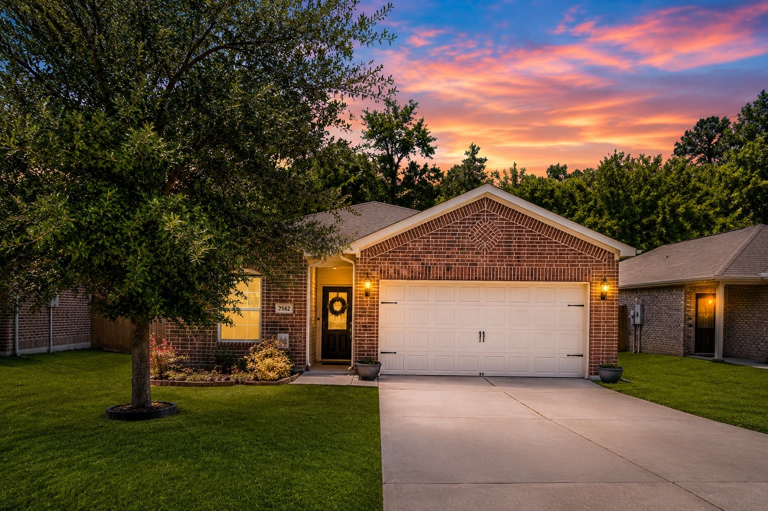 7562 Fettle Lane Conroe, TX 77304 - Photo 1 of 30 Twilight exterior photo digitally enhanced to showcase the home’s evening curb appeal and warm inviting atmosphere.