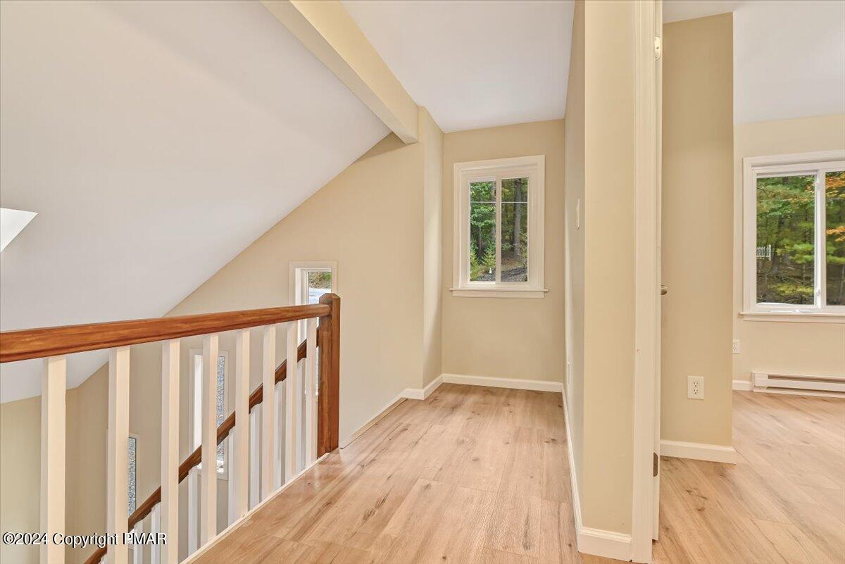 159 Manchester Drive Bushkill, PA 18324 - Photo 24 of 68 a view of hallway with wooden floor and stairs
