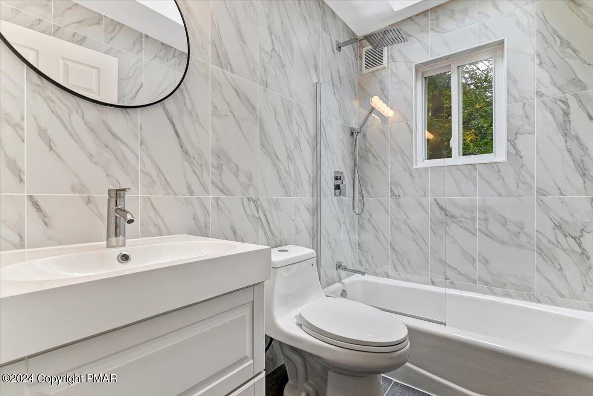 159 Manchester Drive Bushkill, PA 18324 - Photo 38 of 68 a bathroom with a sink a toilet and shower