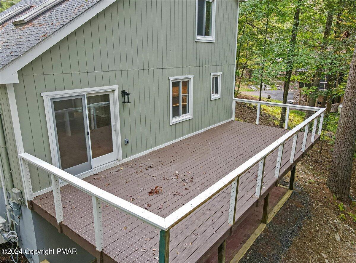 159 Manchester Drive Bushkill, PA 18324 - Photo 42 of 68 a view of balcony with wooden floor and fence