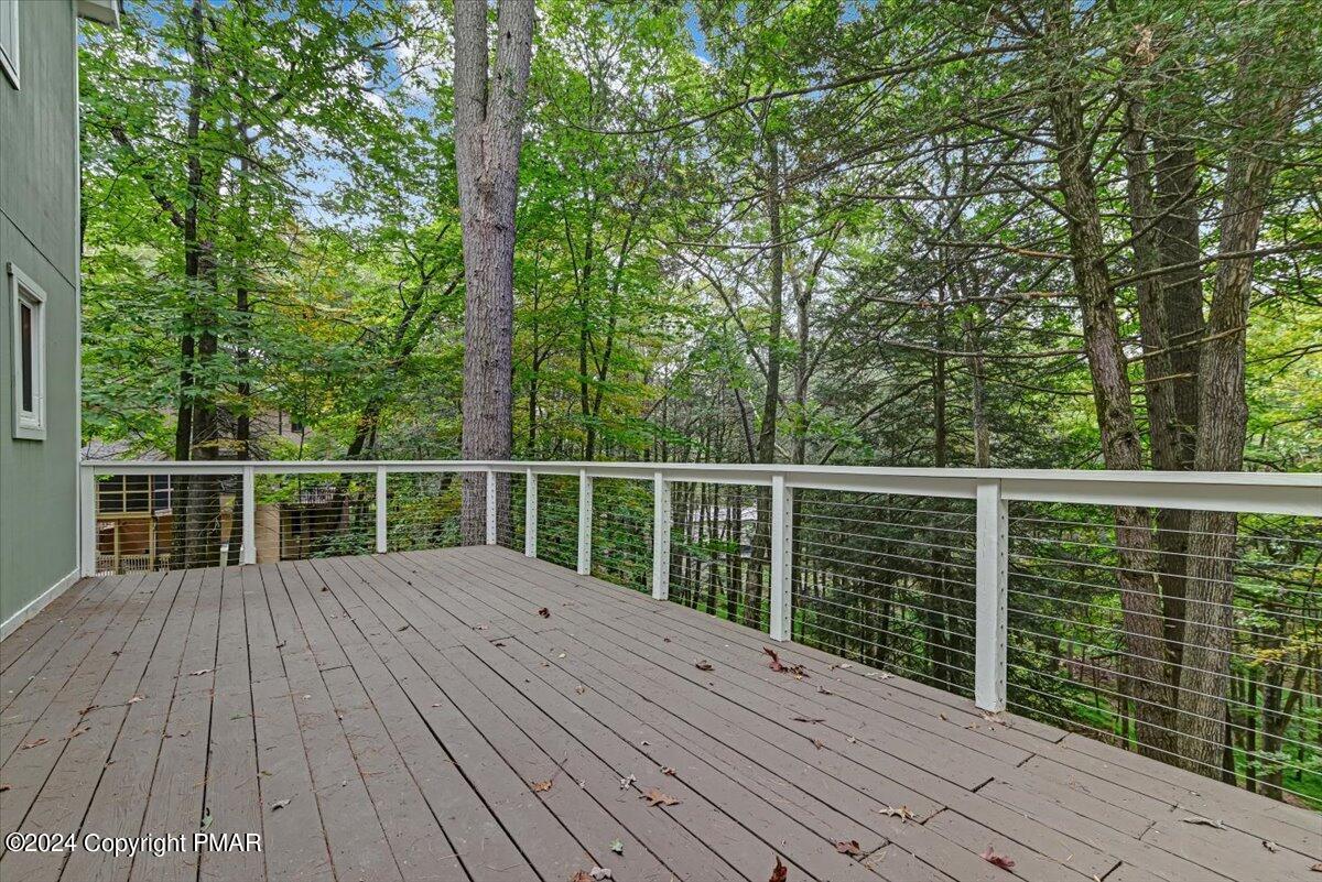 159 Manchester Drive Bushkill, PA 18324 - Photo 43 of 68 a view of deck with wooden floor and fence