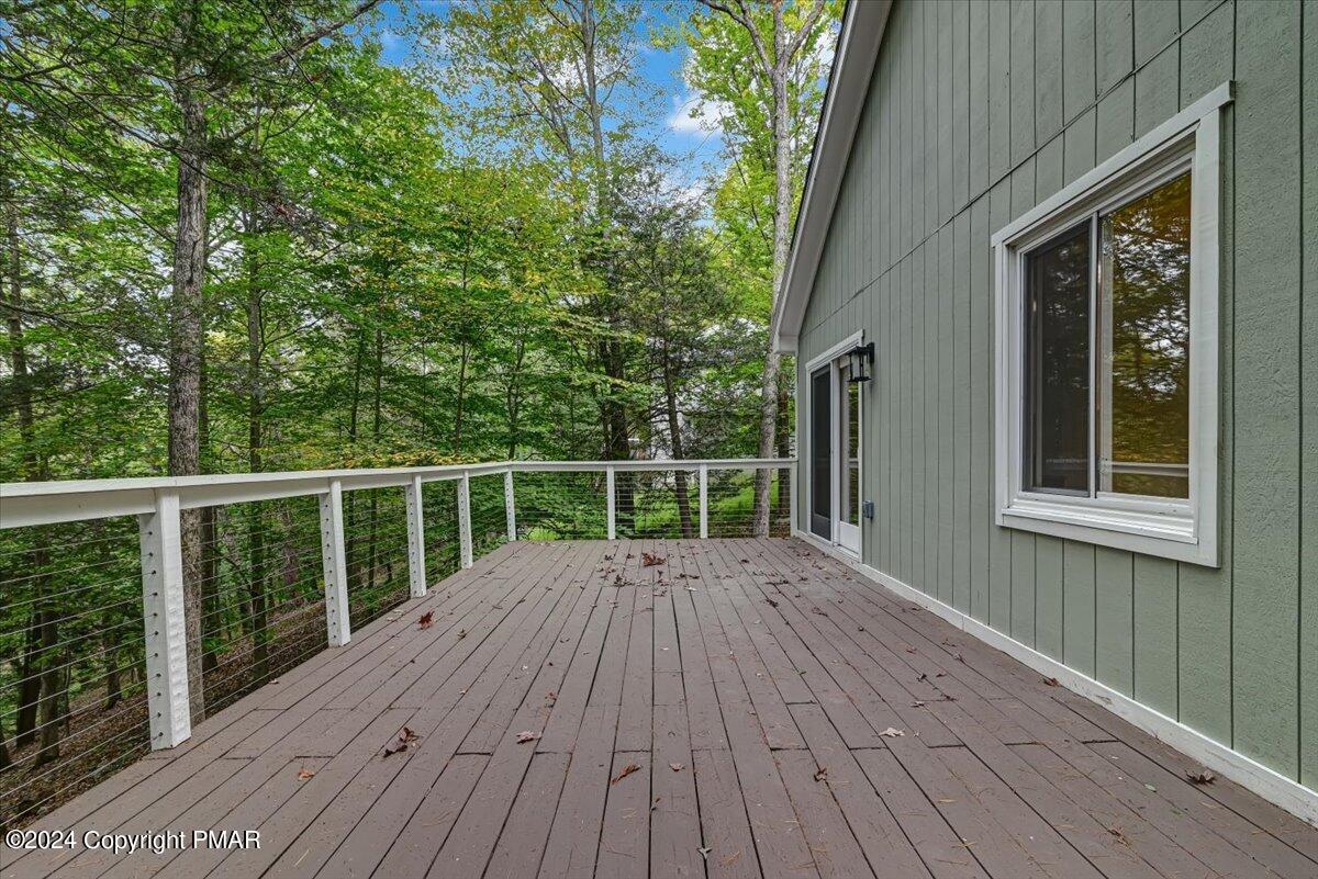 159 Manchester Drive Bushkill, PA 18324 - Photo 44 of 68 a view of backyard with wooden floor and fence