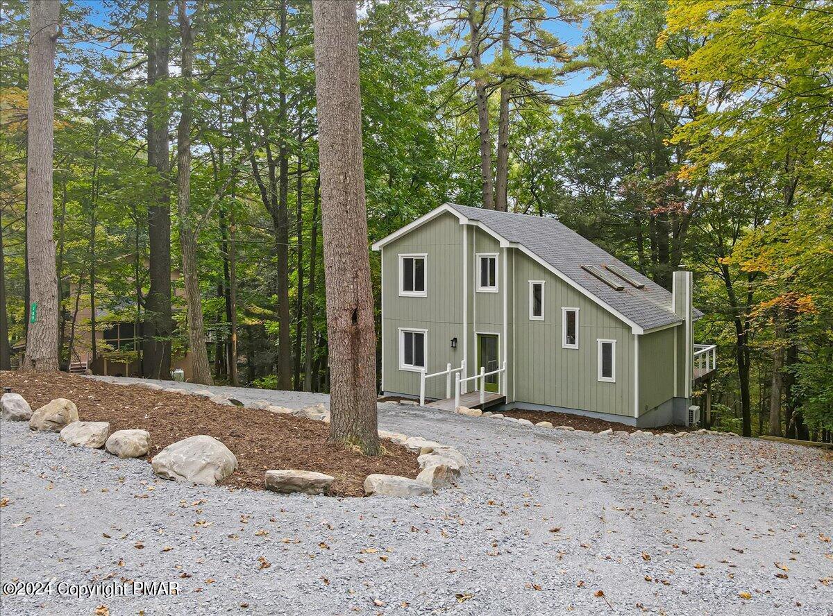 159 Manchester Drive Bushkill, PA 18324 - Photo 5 of 68 a front view of a house with a yard