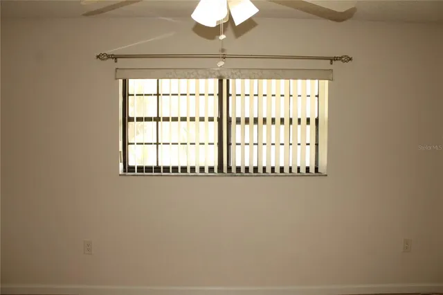 a kitchen with a refrigerator and cabinets