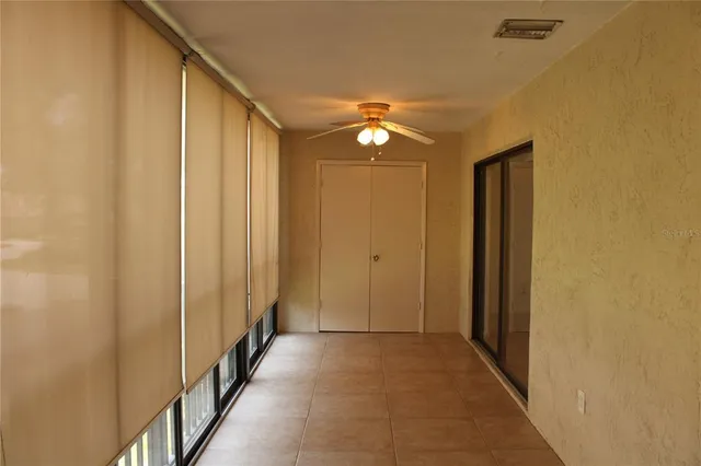 a view of a hallway with windows