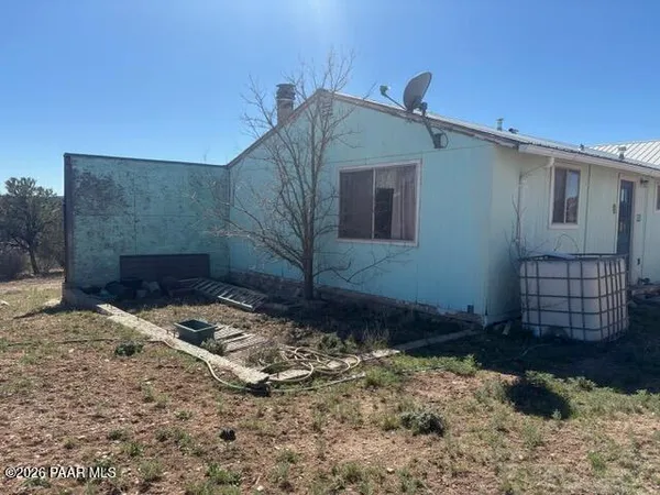 a house view with a backyard