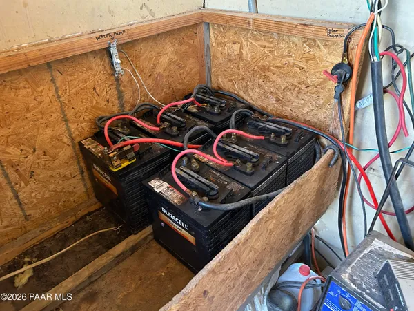 a bathroom with a toilet and a shower curtain