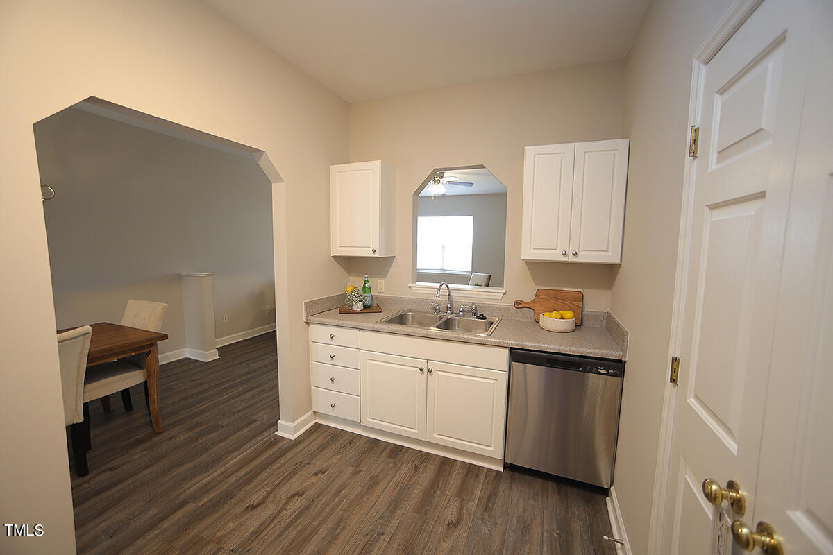 6012 San Marcos Way Raleigh, NC 27616 - Photo 7 of 17 a kitchen with granite countertop a sink and cabinets