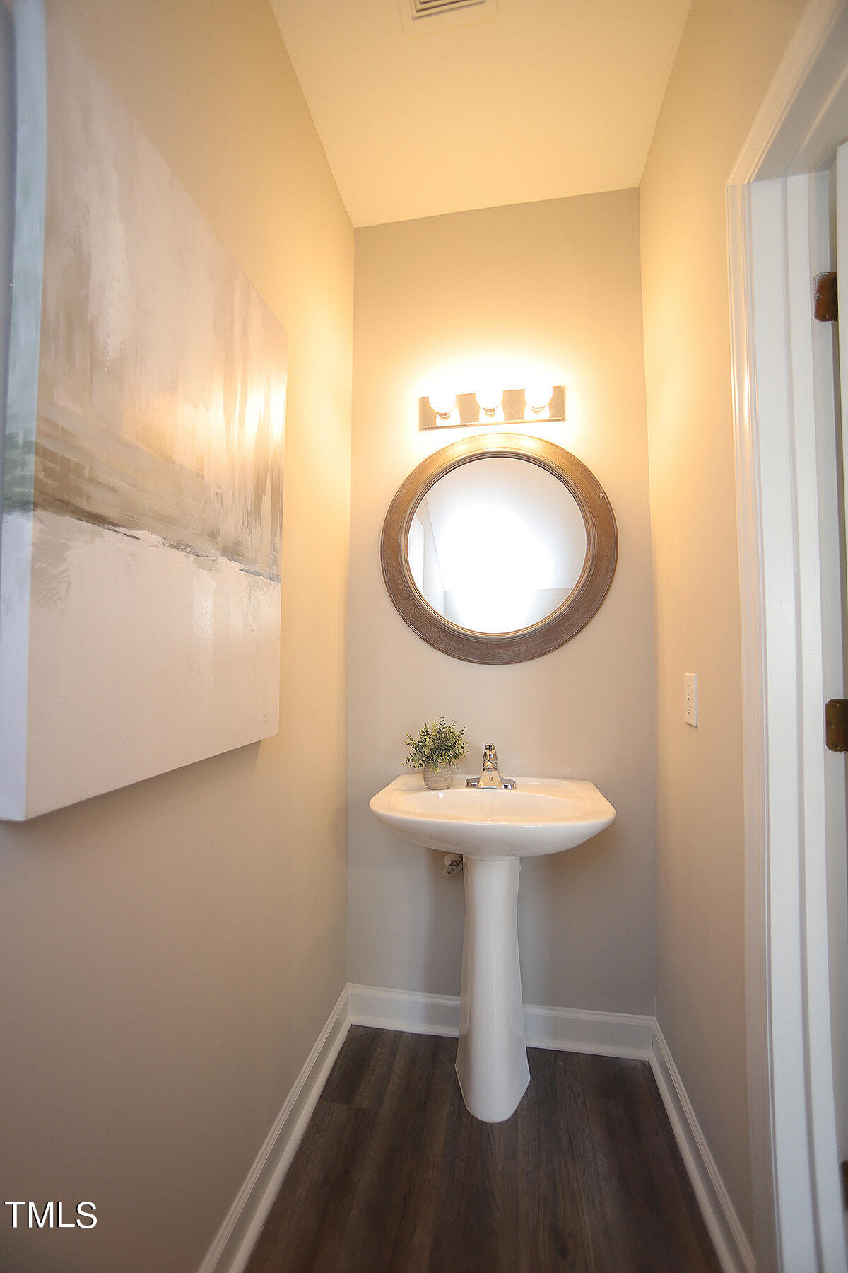 6012 San Marcos Way Raleigh, NC 27616 - Photo 10 of 17 a bathroom with a sink toilet and a mirror