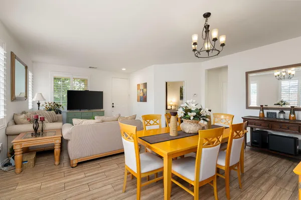 a kitchen with stainless steel appliances granite countertop a refrigerator stove microwave and sink