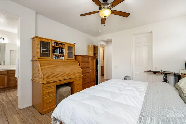 a bedroom with bed and window