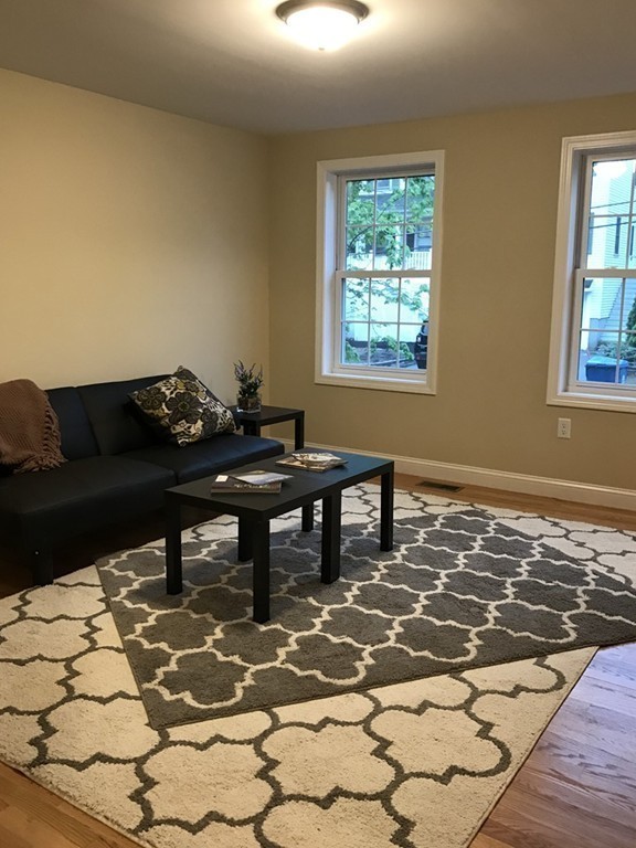 9 Reardon Road Billerica, MA 01821 - Photo 5 of 12 a living room with a couch and a window