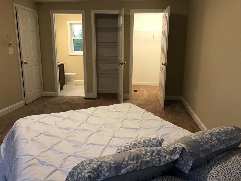 9 Reardon Road Billerica, MA 01821 - Photo 9 of 12 a bedroom with a bed and a window