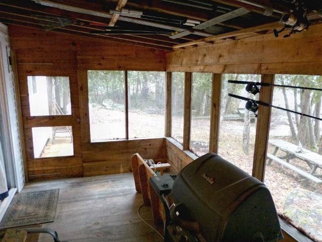 557 Phinney Farm Road Lincoln, ME 04457 - Photo 27 of 32 Screened-in porch interior.