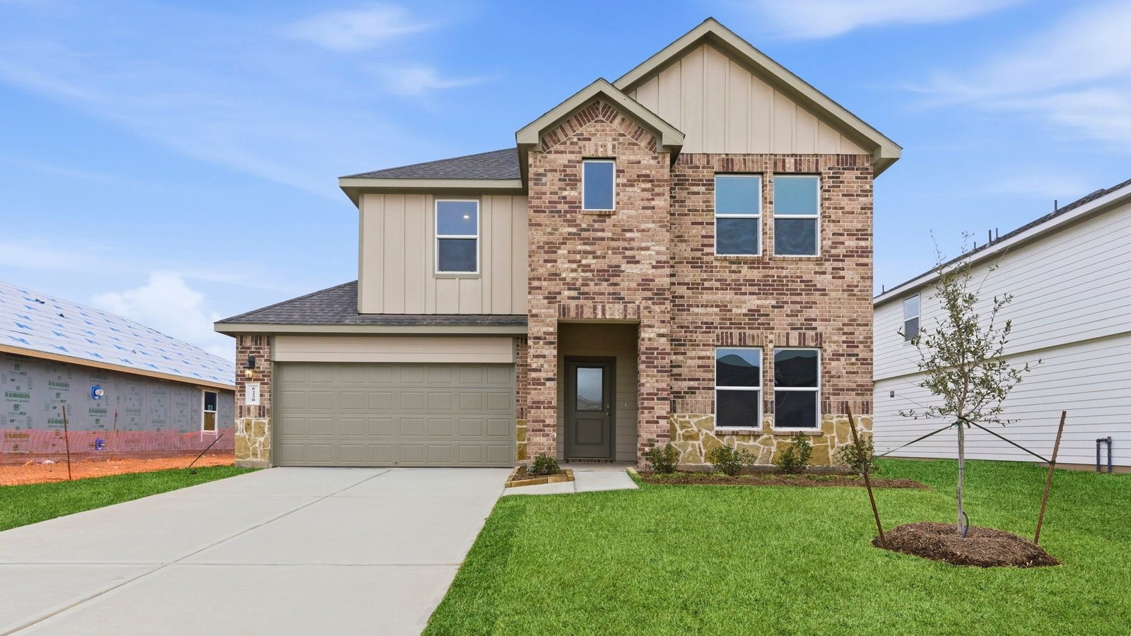 6311 Cherry Mdws Street Rosenberg, TX 77469 - Photo 1 of 43 a front view of a house with a yard and garage