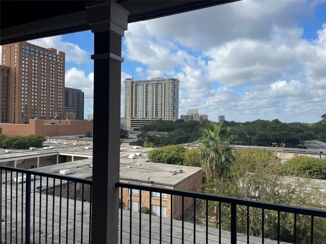 a view of a street from a balcony