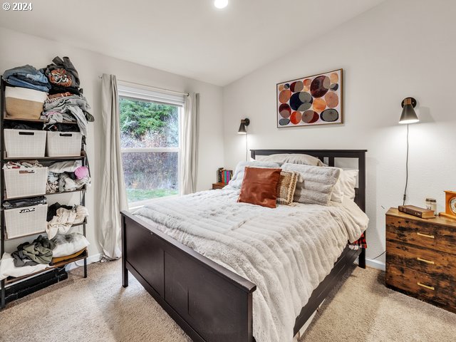 22575 Business 18 Willamina, OR 97396 - Photo 12 of 24 a bedroom with a bed and a painting on the wall
