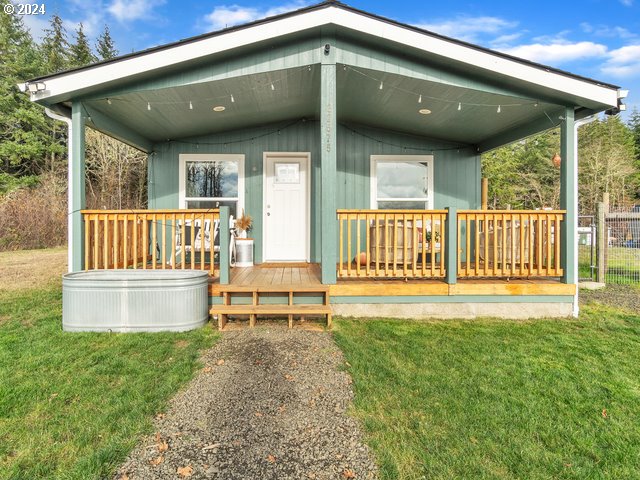 22575 Business 18 Willamina, OR 97396 - Photo 2 of 24 a view of a chair and table in the backyard