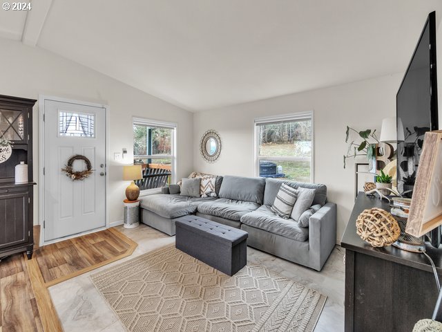 22575 Business 18 Willamina, OR 97396 - Photo 5 of 24 a living room with furniture and a flat screen tv
