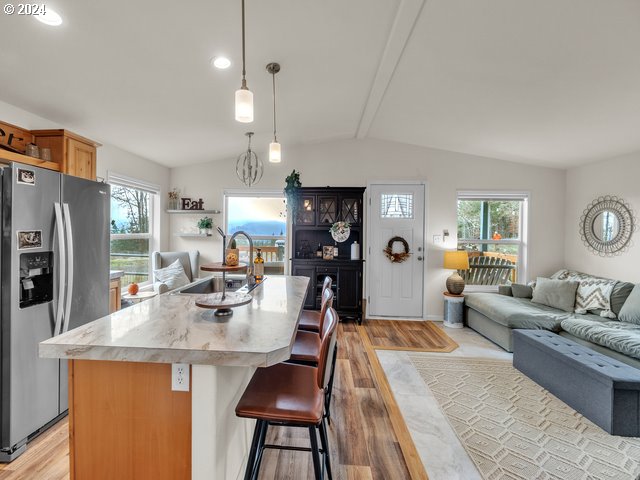 22575 Business 18 Willamina, OR 97396 - Photo 8 of 24 a living room with stainless steel appliances granite countertop furniture and fireplace