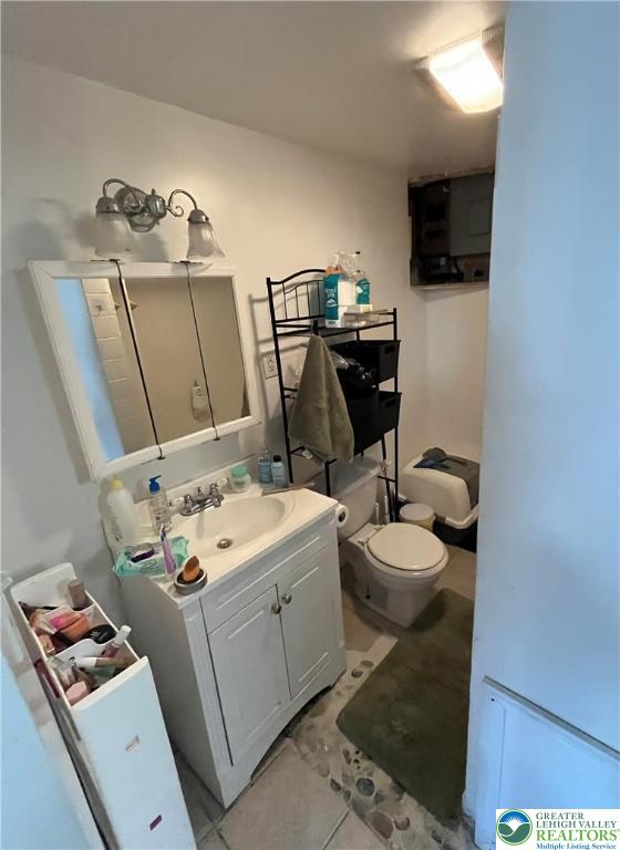 1239 4th Street Slatington, PA 18080 - Photo 12 of 17 a bathroom with a toilet sink and mirror
