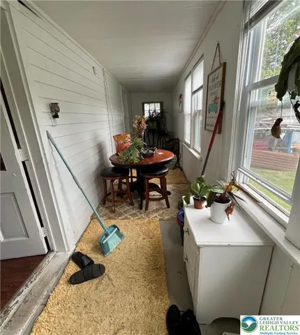 a view of a chair and table in backyard