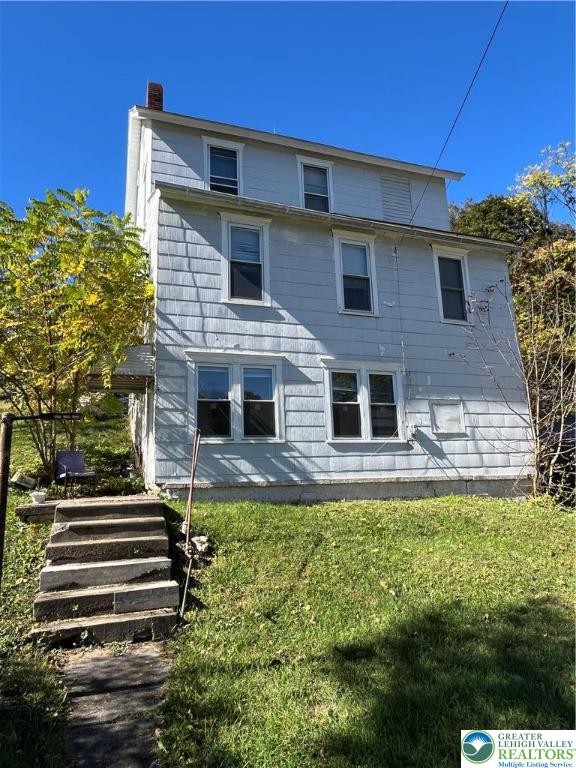 1239 4th Street Slatington, PA 18080 - Photo 15 of 17 a front view of a house with a yard