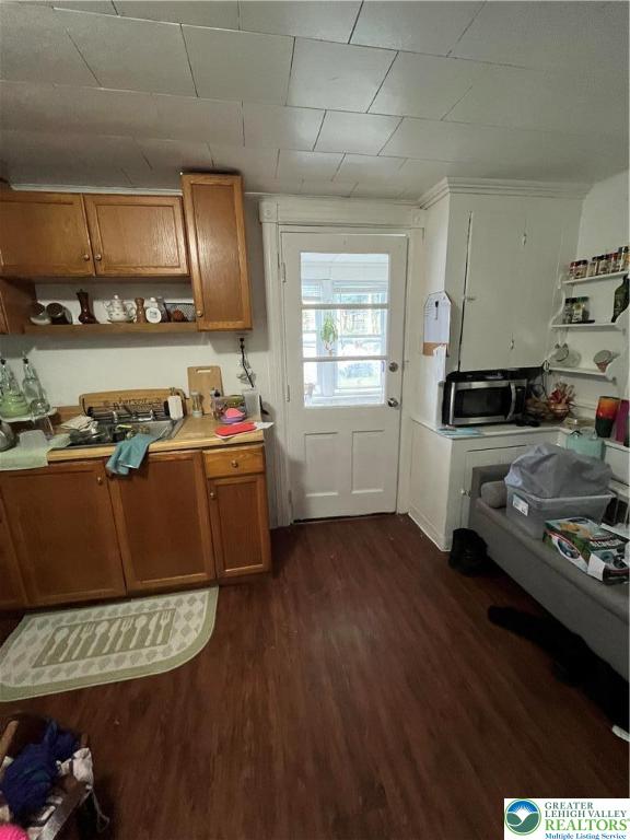 1239 4th Street Slatington, PA 18080 - Photo 7 of 17 a kitchen with stainless steel appliances granite countertop a stove a sink and a refrigerator
