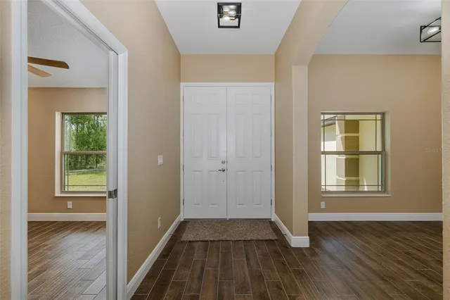 a view of kitchen with cabinets and wooden floor