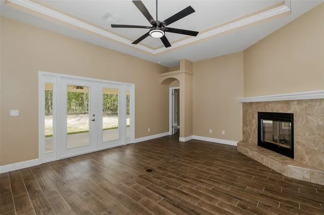 a bathroom with a granite countertop bathtub a sink and a mirror
