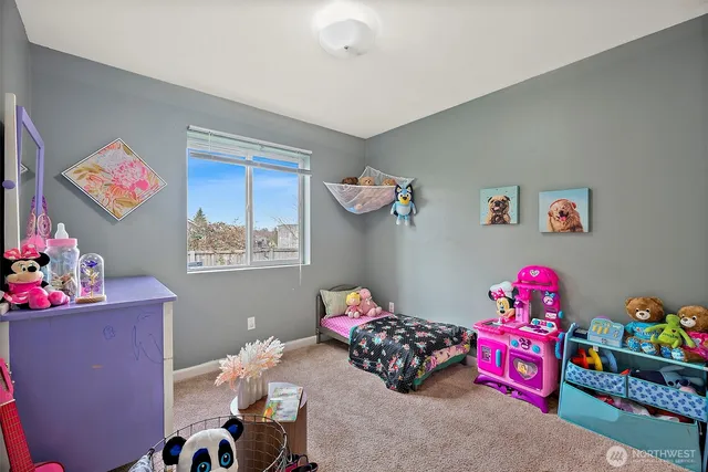 a bedroom with toys and a couch