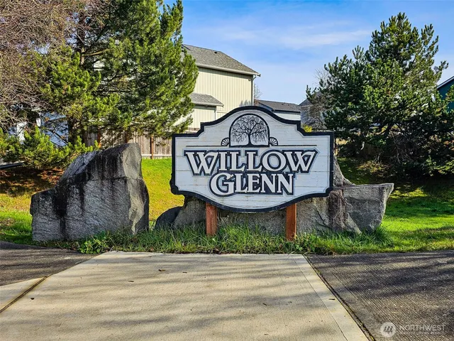 a sign on a street next to a building