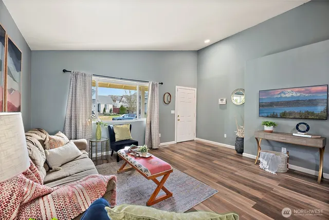 a living room with furniture and a window