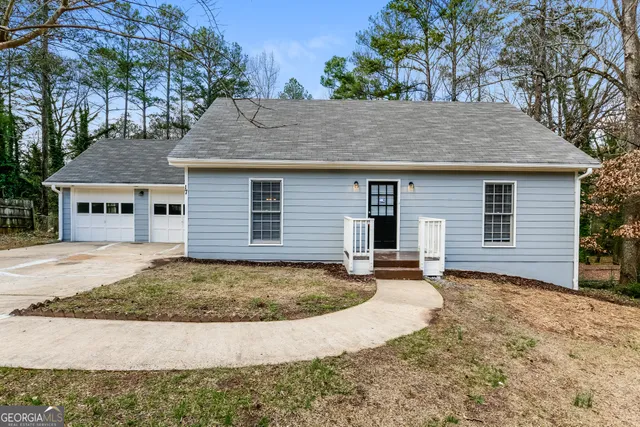 a view of a house with a sink and yard