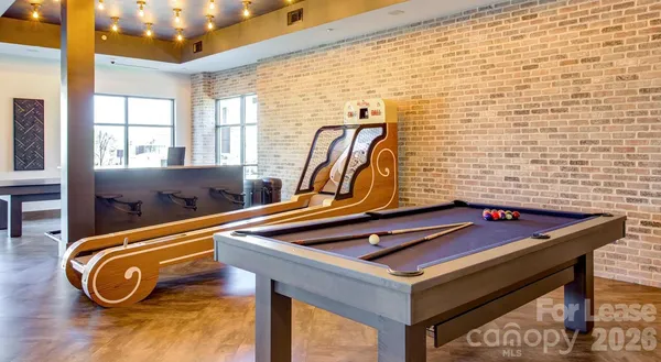 a view of a dining room with furniture and window