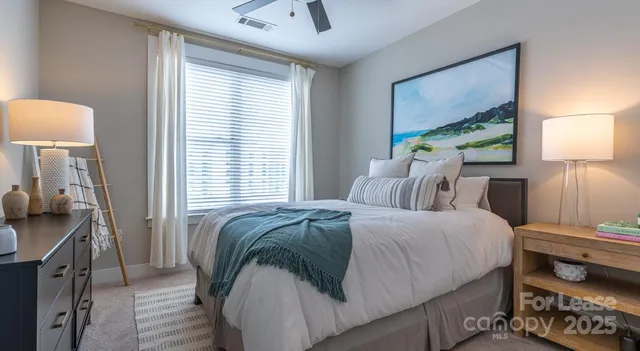 a bedroom with bed and window