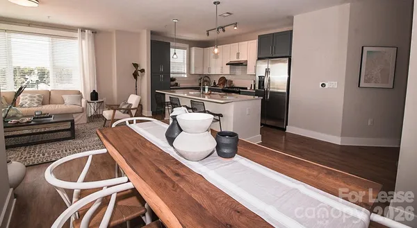 a kitchen with a refrigerator and a sink