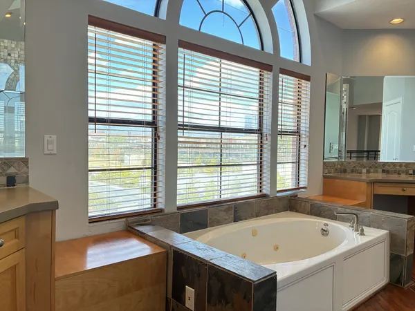 a bathroom with a bathtub and a sink